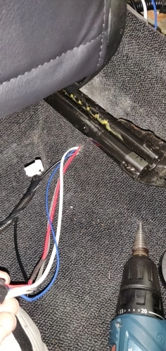 Kicker 46HS10 connection cable running through carpet near driveshaft tunnel