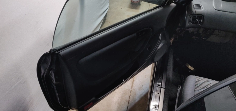 Door panel installed with Polk Audio crossover to check for fitment