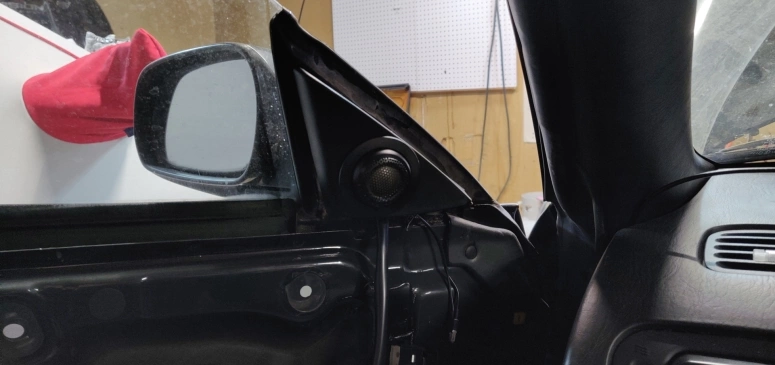 Side mirror trim with new tweeter installed