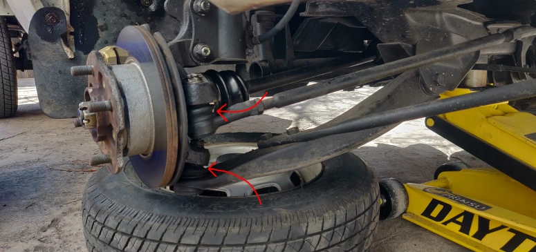 Lower control arm ball joint boot and tie rod boot location