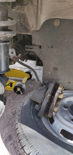 Caliper removed laying on wheel