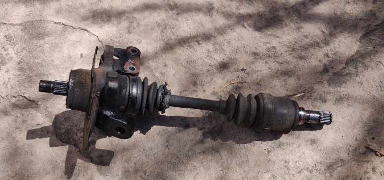 CV axle removed with knuckle still attached