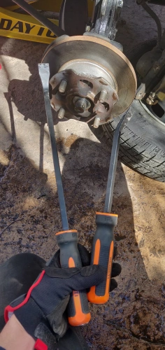 Two pry bars for removing the axle hub