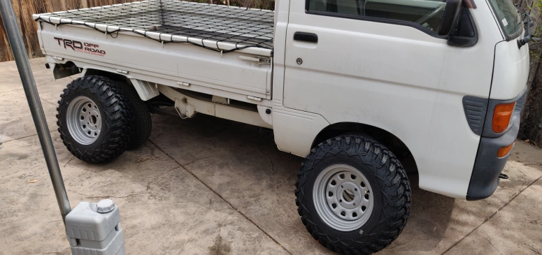 New wheels and tires next to the old ones